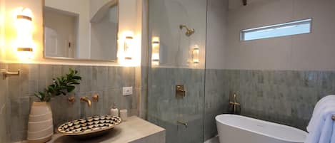 Shower, towels, soap, toilet paper