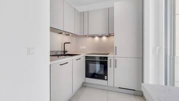 Coffee/tea maker, fridge, microwave, oven