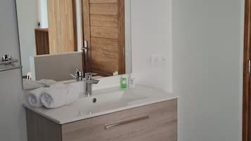 Shower, towels, soap, toilet paper