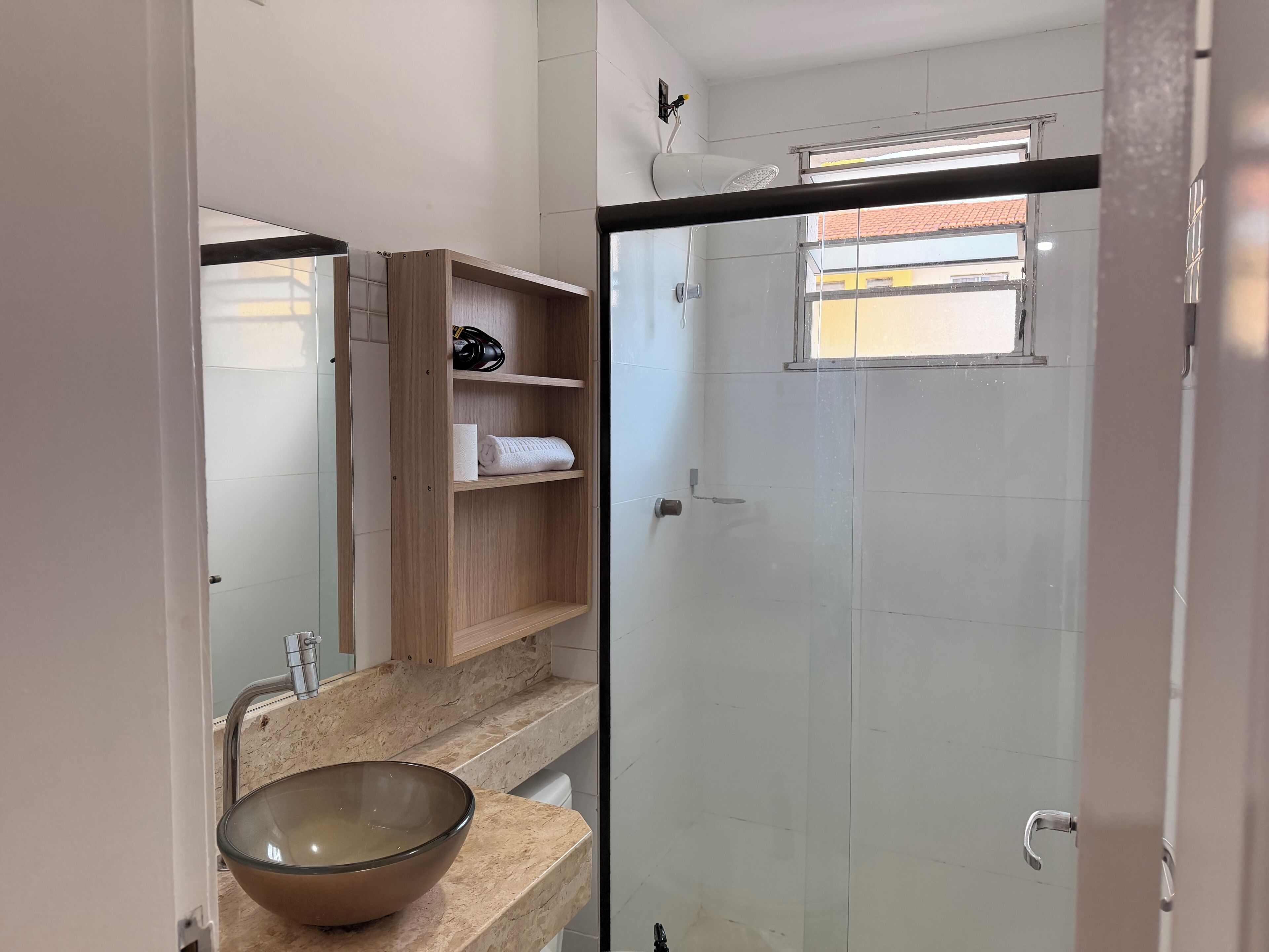 Shower, hair dryer, towels, toilet paper
