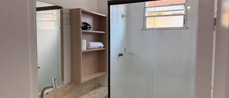 Shower, hair dryer, towels, toilet paper