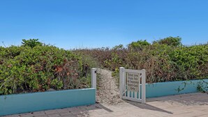 A gated entrance to a private patio area with a sign indicating it is for residents and guests only. - INCREDIBLE! Oceanfront Dream Escape! Unit 21 is a Rare 3-Bedroom Condo! (Cocoa Beach)