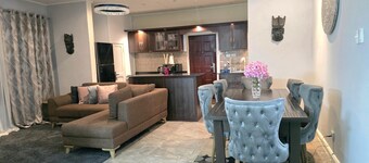 Luxury 4BR house with 2 Living areas, Wi-Fi, 24hr security, great for families.