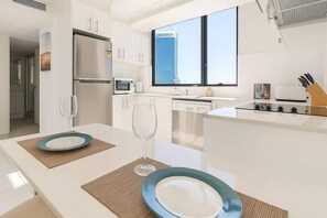 Fridge, microwave, oven, stovetop - High-Floor 2BR Ocean View Escape (Surfers Paradise)