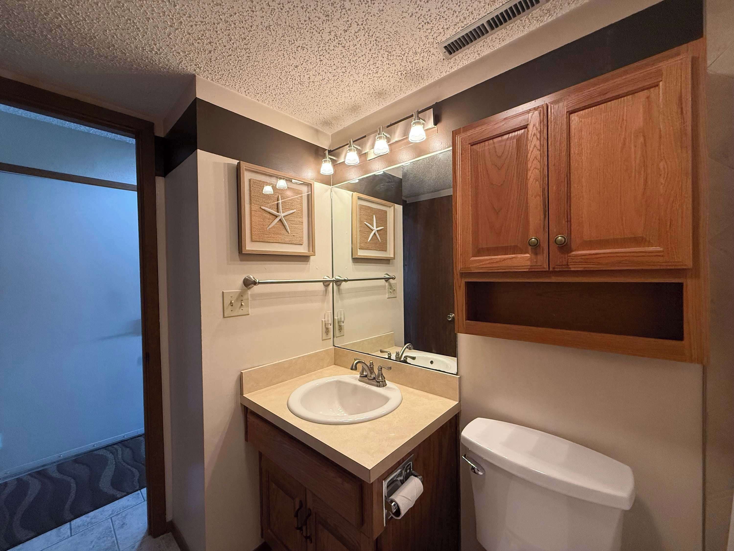 Shower, hair dryer, towels, shampoo