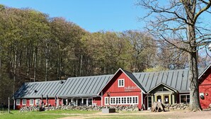 A red building with a sign reading 'naturum Soderasen.' - 6 Person Holiday Home in Ljungbyhed (Ljungbyhed)