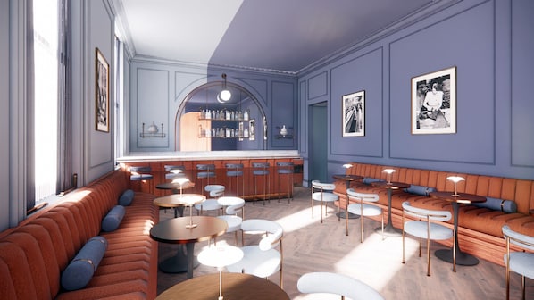 A bar area with stools, a bar counter, and a seating area with sofas and tables.