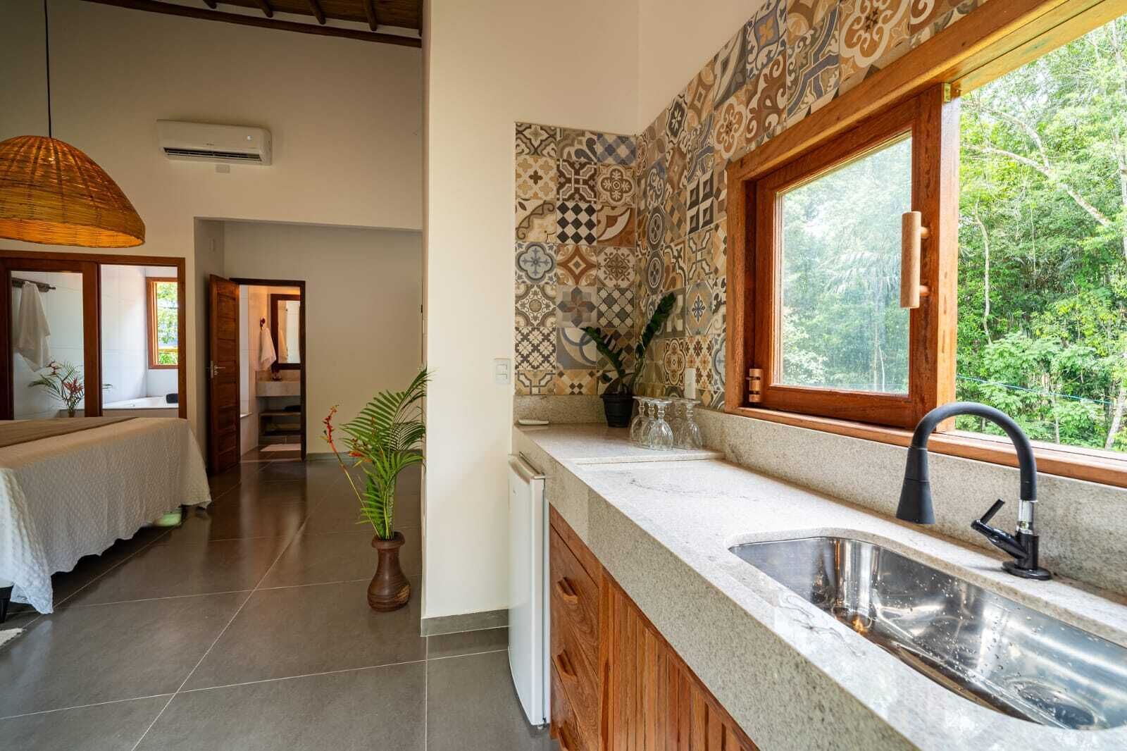 Departamento Deluxe, vista al jardín | Cocina privada