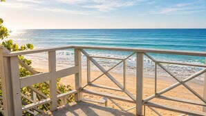 A beach view with a wooden railing, sandy beach, and ocean. - CasaMar Oceanfront House w/ Pool & Master Suite• Rincón (Aguada)