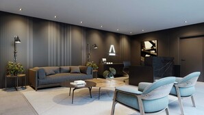 A modern living room with a sofa, two armchairs, a coffee table, and a desk with a computer. - Altamare 203 - Luxury and comfort right on the sand at Caribessa beach. (João Pessoa)