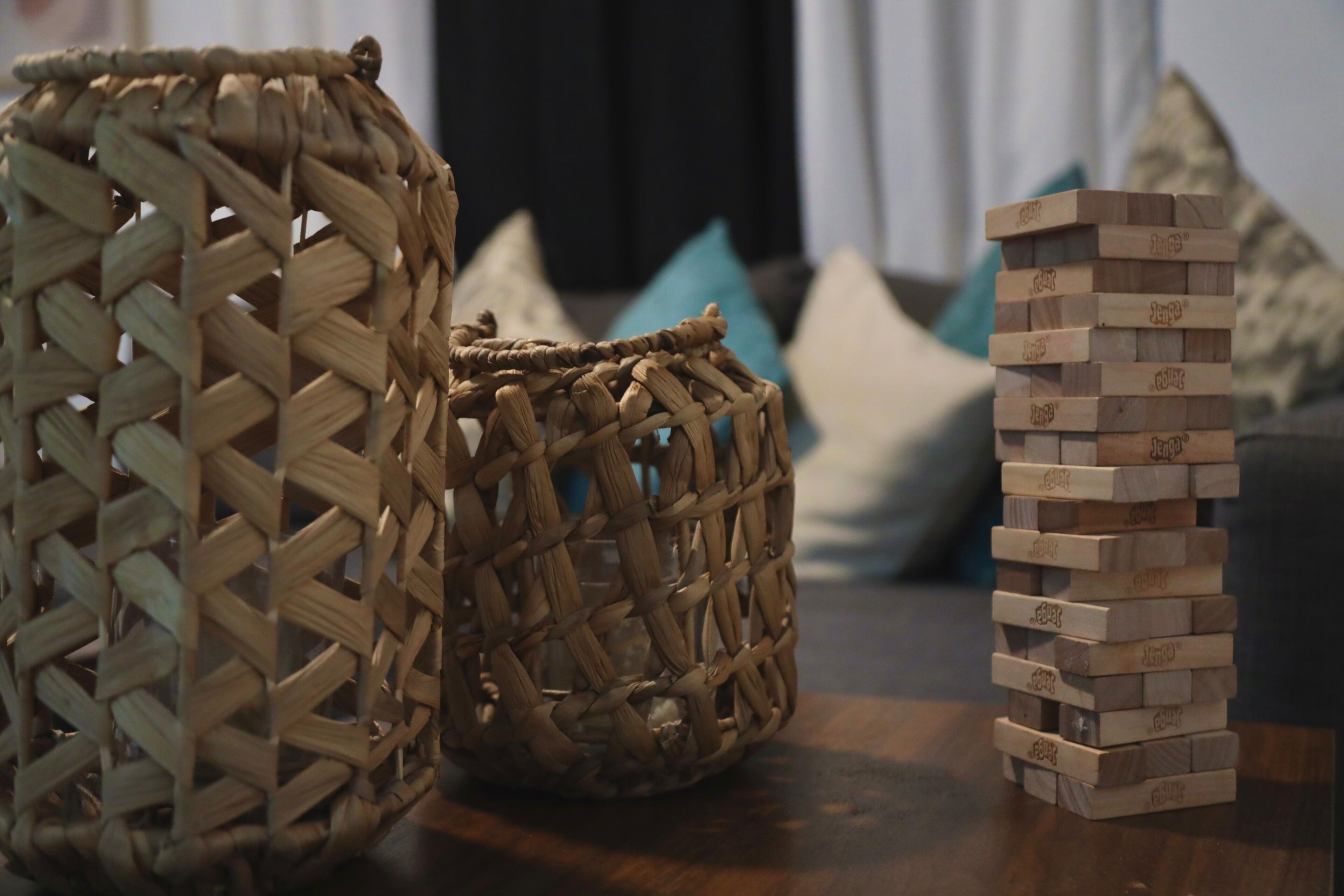 Two woven baskets and a stack of wooden blocks.