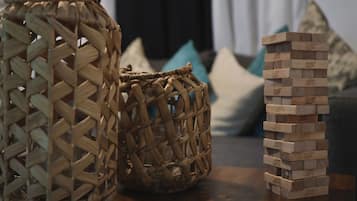 Two woven baskets and a stack of wooden blocks.