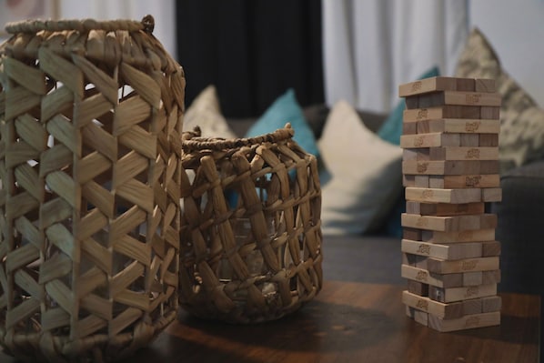 Two woven baskets and a stack of wooden blocks.