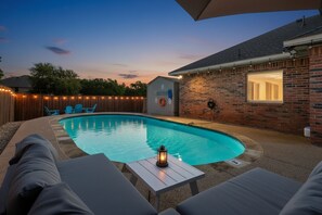 A backyard with a swimming pool, lounge chairs, and a small shed. - French-style 5-bd w/ Pool, Playground, Cinema (Lewisville)