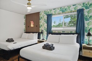 A hotel room with two beds, a ceiling fan, a window with curtains, and a cactus-themed wall. - 5BR Near At&t Stadium Pool, Golf Sim, EV (North Richland Hills)