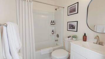 Combined shower/bathtub, hair dryer, towels, soap