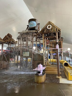 A water play area with a wooden structure, a water slide, and a water fountain. - Lakefront home in Osage Beach - Newly Renovated (Osage Beach)