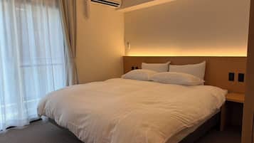 Deluxe Double Room, Balcony | In-room safe, desk, laptop workspace, blackout drapes