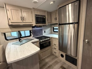 Private kitchen - Cozy 1-bedroom recreational vehicle in Flint, TX with AC (Flint)