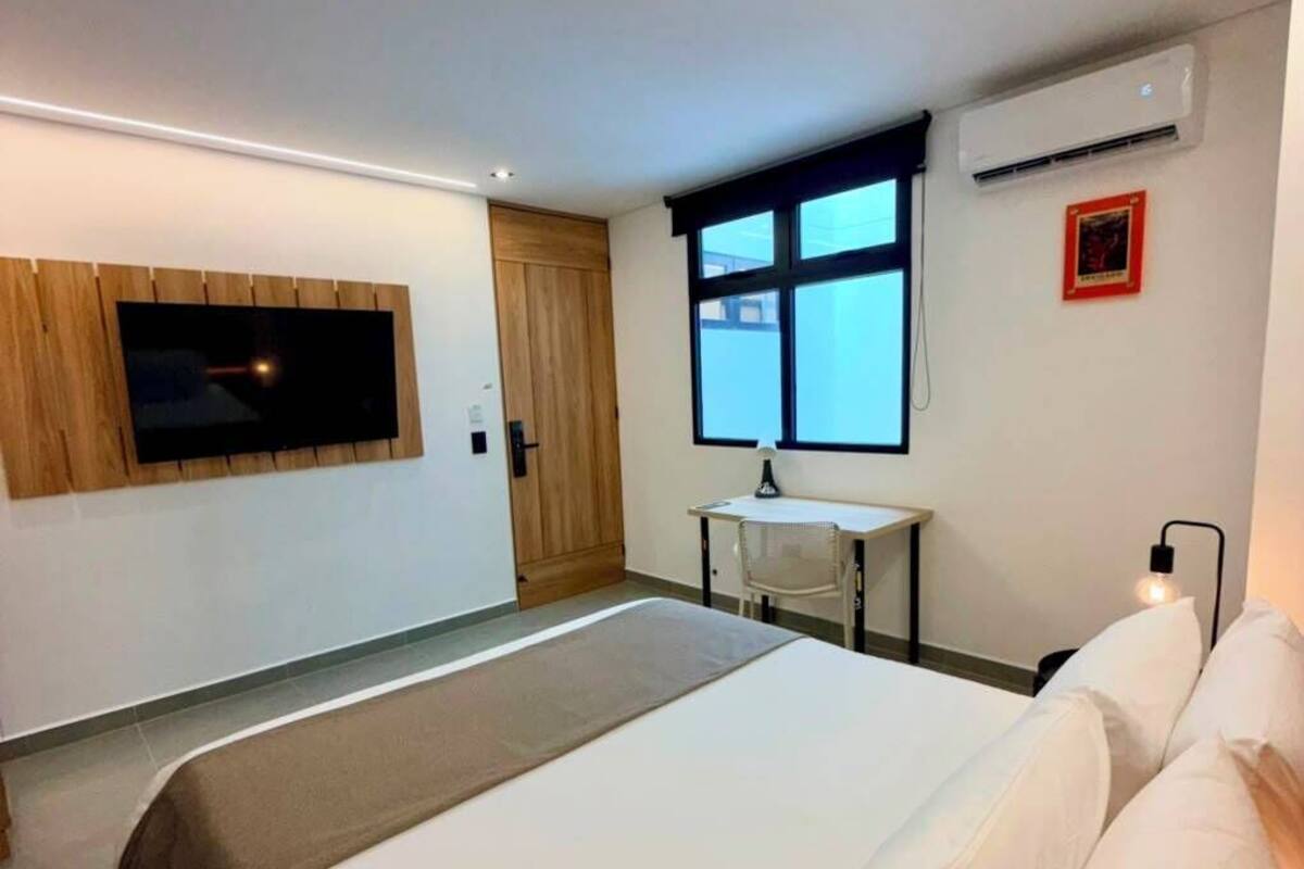 Desk, laptop workspace, free WiFi, bed sheets