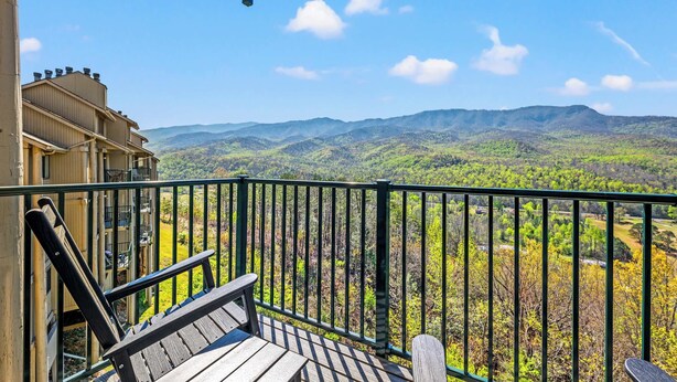 A balcony with a view of a mountainous landscape. - Mountain View Condo w/ Indoor Pool & Golf Access (Gatlinburg)