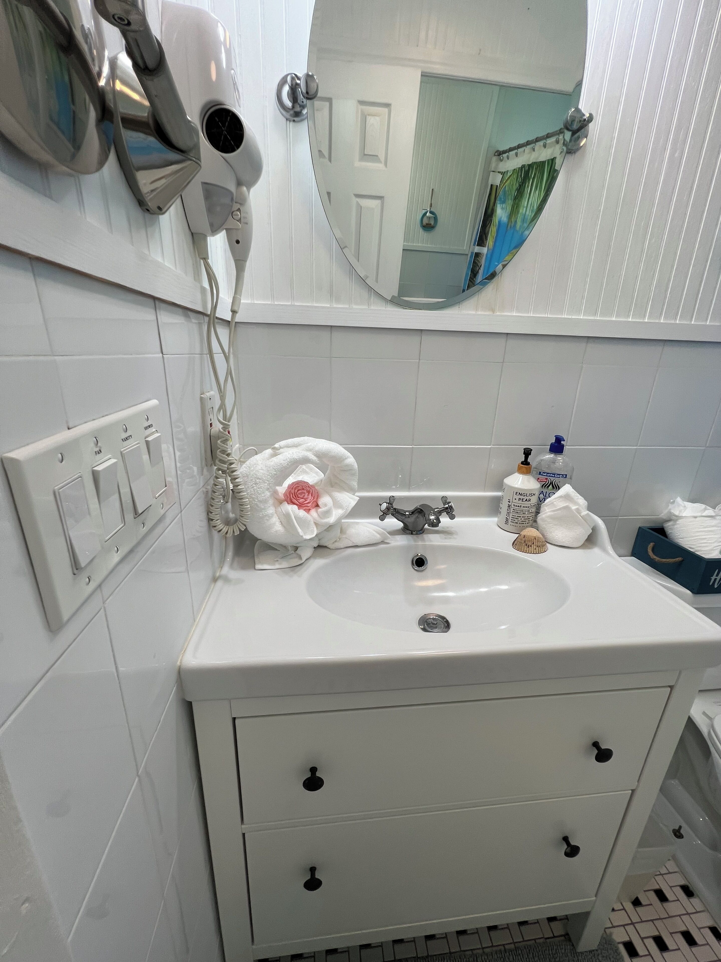 Hair dryer, towels, soap, shampoo