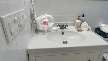 Hair dryer, towels, soap, shampoo
