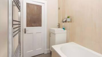 Shower, hair dryer, towels, shampoo