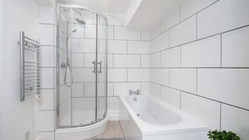 Shower, hair dryer, towels, shampoo