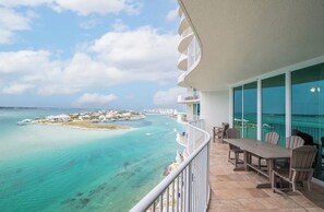 A balcony with a view of turquoise waters and a small island. - NEW! NEW! NEW! ,TOP OF THE LINE, 3 BED/3 BATH UNIT!ASK ABOUT OUR BEST PRICE! (Orange Beach)