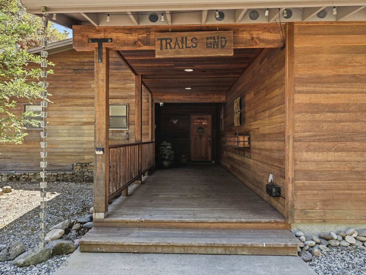 A wooden building entrance with a sign reading 'TRAILS END'.