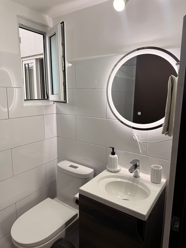 Shower, hair dryer, towels, soap