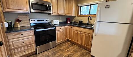 Fridge, microwave, stovetop, coffee/tea maker