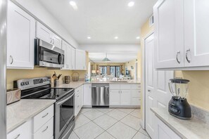 Fridge, microwave, oven, stovetop - Gorgeous Cocoa Beach Condo with Private Balcony Heated Pool & Hot Tub! ☀️ (Cocoa Beach)