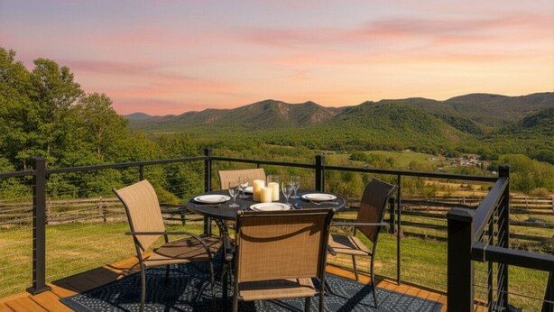 A table set outdoors with chairs, a view of mountains, and a sunset. - Panoramic Mountain Views + Private Hot Tub — Your Ultimate Shenandoah Valley Escape (Raphine)