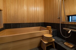 A wooden bathtub with a shower head and a small wooden stool. - Mibu Dodan Momiji (Kyoto)