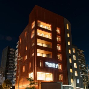 A multi-story hotel with a prominent 'Terrace Hotel' sign, featuring balconies and a modern architectural design. - Terrace Hotel f Shinosaka (Osaka)