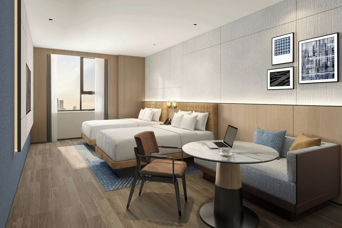 Quarto superior, 2 camas de casal, vista para a cidade