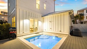 A residential property with a swimming pool, a covered patio, and a garage. - Walk to Beach in Blue Mtn! Private Pool, LSV/Golf Cart, & Bikes! Sleeps 17! (Santa Rosa Beach)