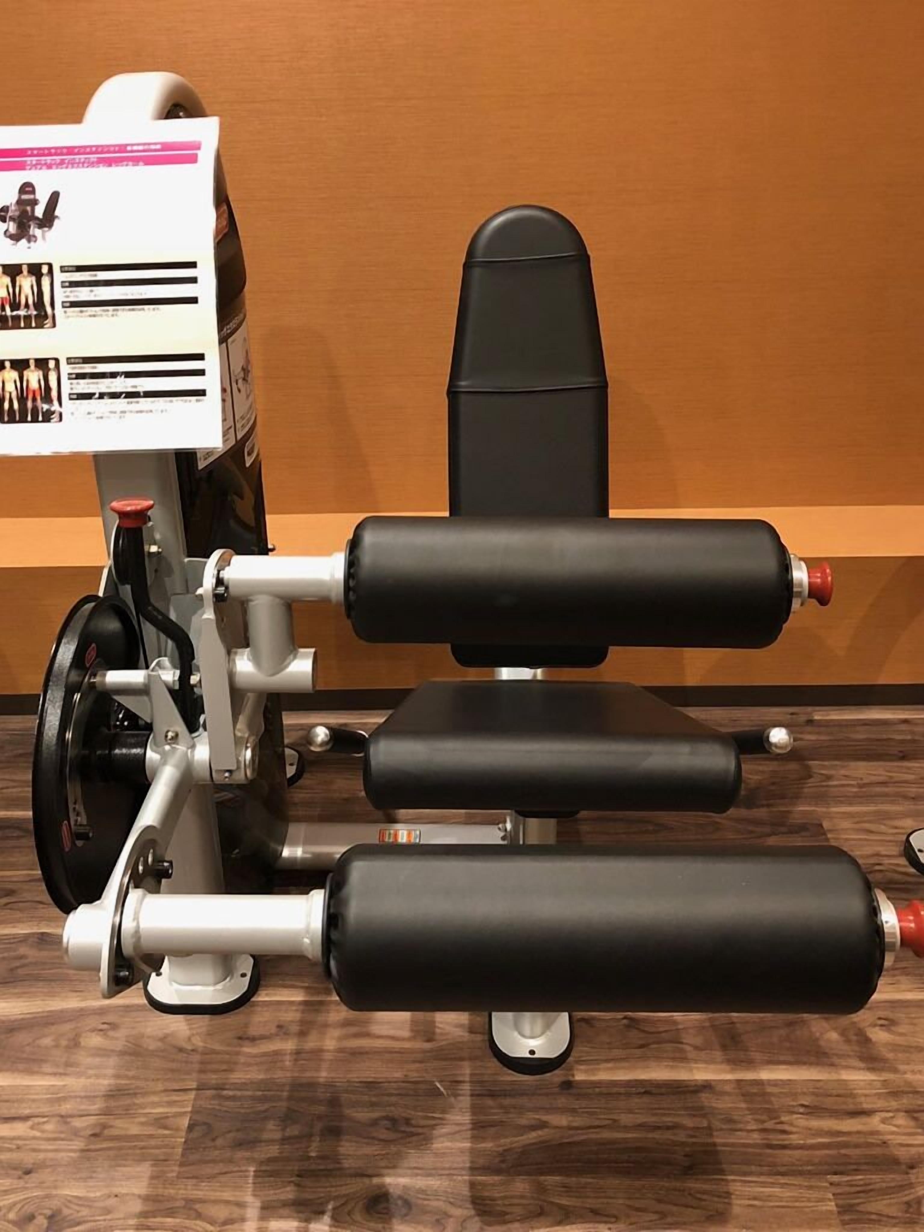 A gym with exercise equipment, including a bench and weights.