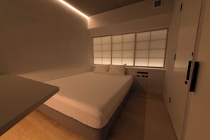 Une chambre moderne avec un grand lit, des tables de chevet, une fenêtre avec des stores et une armoire.