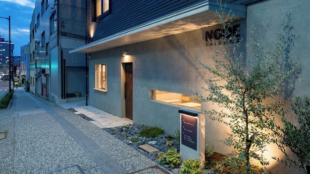 A modern building with a sign reading 'NICE' and a small entrance.