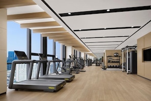 A gym with treadmills, elliptical machines, and weight equipment. - Courtyard Sejong (Sejong)