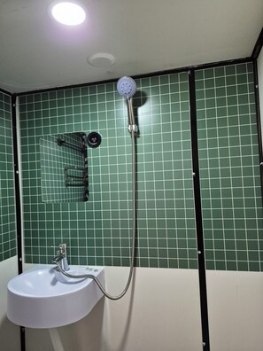 Shower, hair dryer, towels, soap