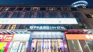 A hotel with a prominent sign for 'Crystal' and a large illuminated facade. - Orange Crystal Shanghai Lujiazui Expo (Shanghai)