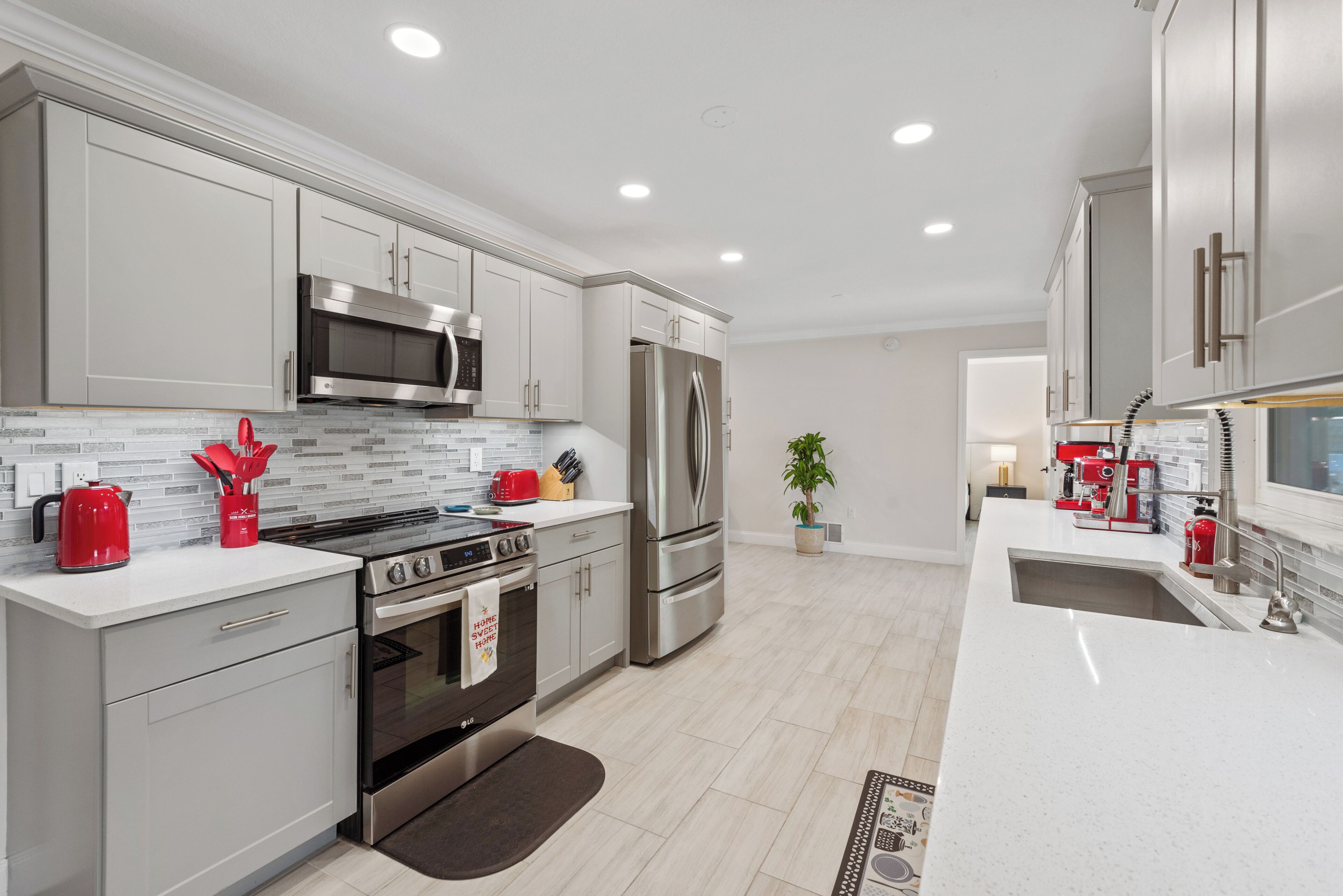 Full-sized fridge, stovetop, cookware/dishes/utensils