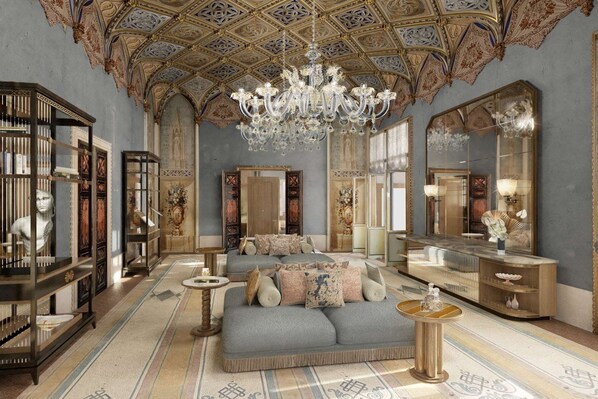 A luxurious room with a grand chandelier, ornate ceiling, and a large bed with plush pillows. - Orient Express Palazzo Dona Giovannelli (Venice)