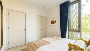 A bedroom with a bed, two doors, a window with curtains, and a framed picture on the wall. - Balham Modern - Stylish 1bed Flat With Balcony (Moffat)
