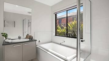 Shower, hair dryer, towels, shampoo