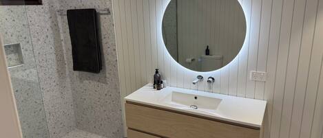 Shower, hair dryer, towels, soap
